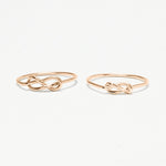 The 2 Unity Infinity-Knot Rings