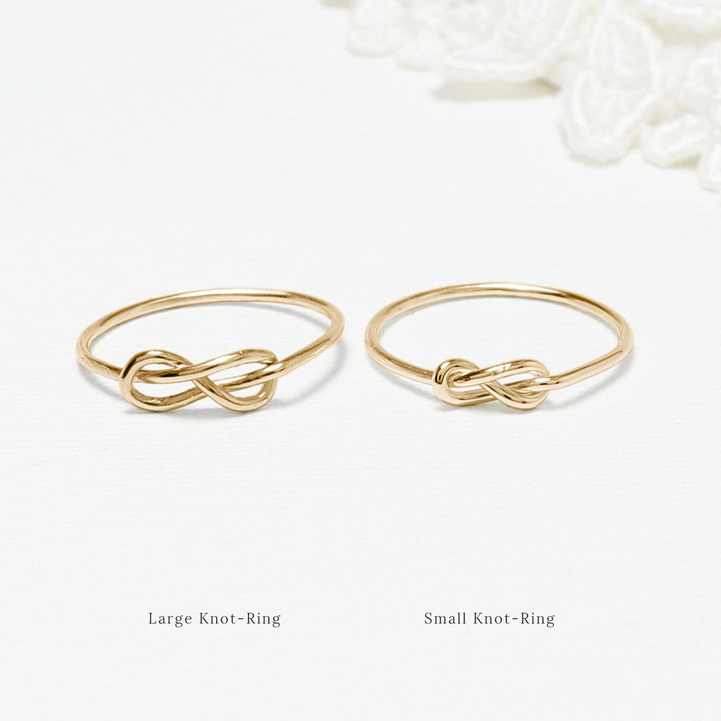 The 2 Unity Infinity-Knot Rings